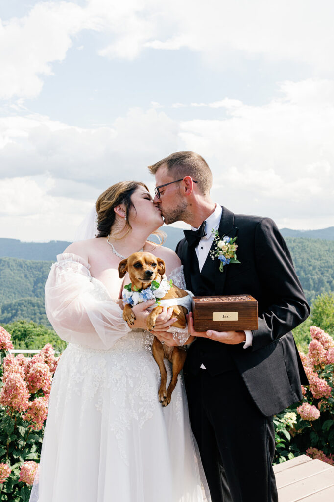 Bride and groom share a kiss during their mountain wedding at The Summit at Cross Mountain.