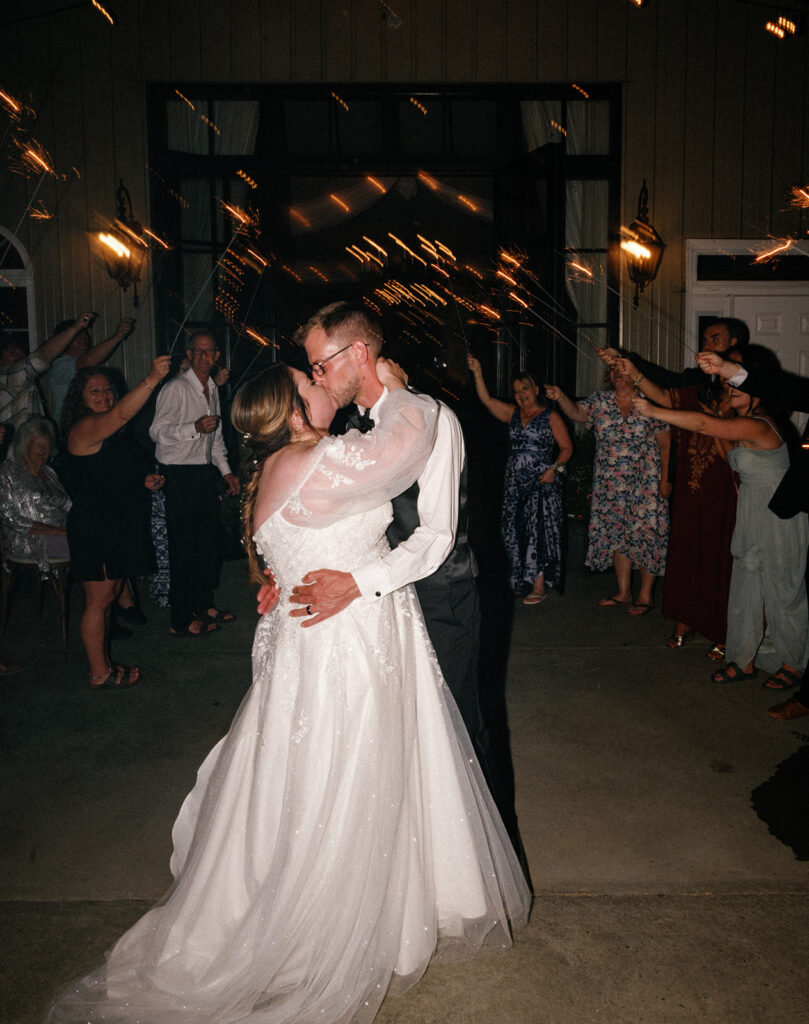 Sparkler exit kiss at the end of the night of the wedding