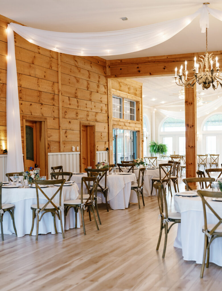 Reception table decor with florals and candlelight at The Summit at Cross Mountain.