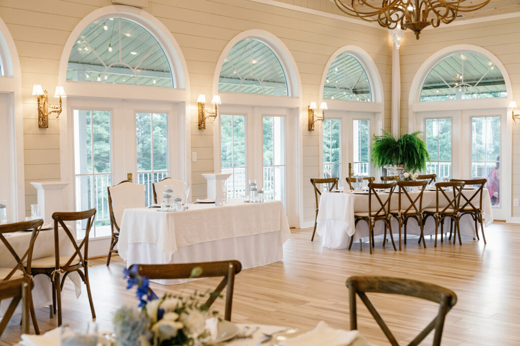 Reception table decor with florals and candlelight at The Summit at Cross Mountain.